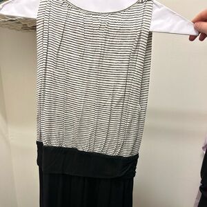 Loft sleeveless dress with black and white stripes top and black skirt.